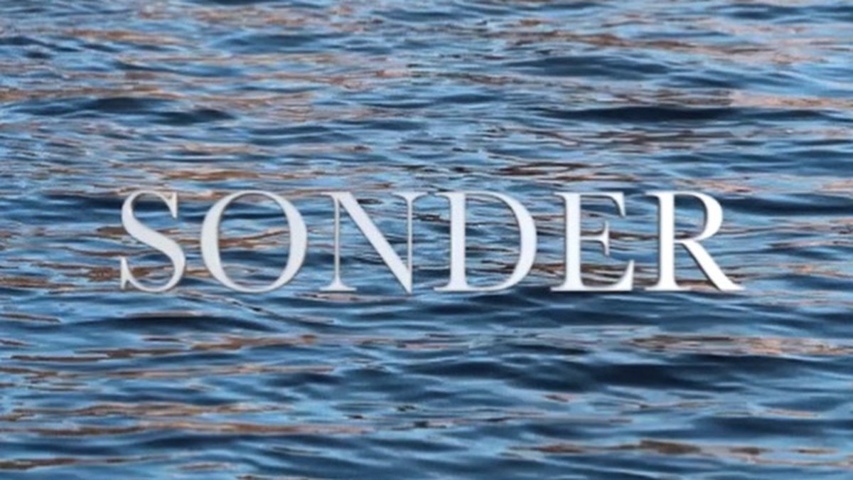 Sonder, written over moving water